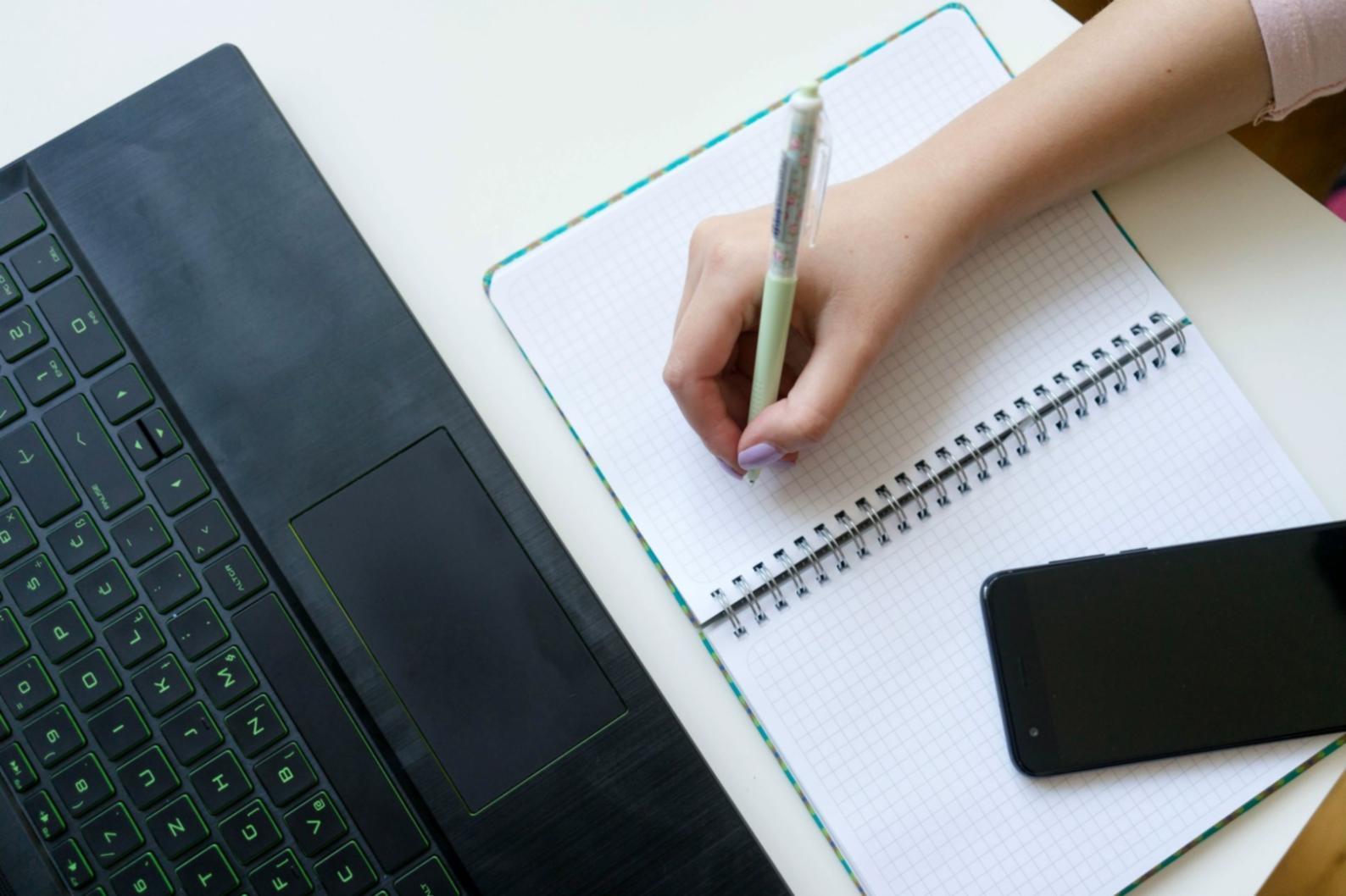A focused individual working through vocabulary exercises